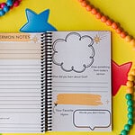 The Sermon Note Journal on yellow paper surrounded by colored beads. It is open to the sermon note page