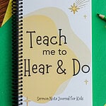 The Sermon Note Journal for Kids on green and yellow paper with colored pencils.