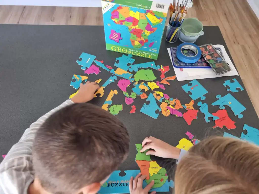 Colorful Africa and Middle East puzzle on table for kids educational activity.
